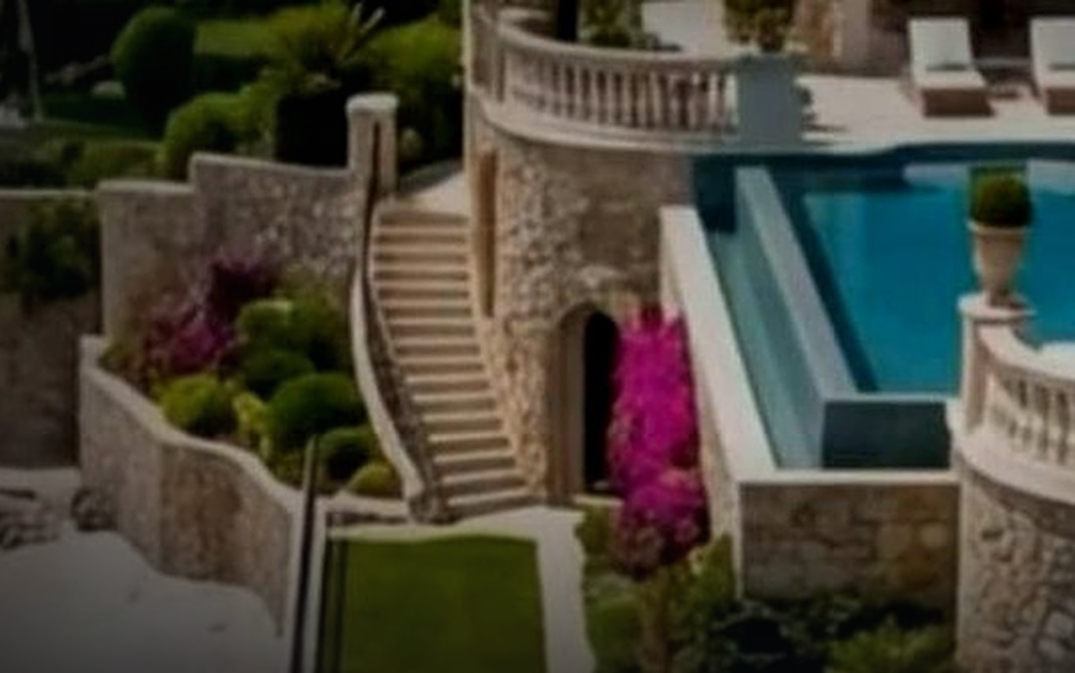 A cliffside villa with an infinity pool above the sea